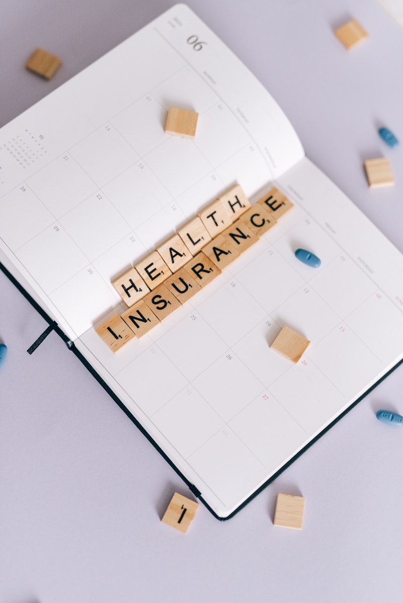 Health Insurance Scrabble Tiles on Planner