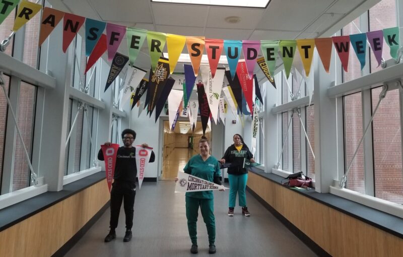 Students standing under National Transfer Week banner