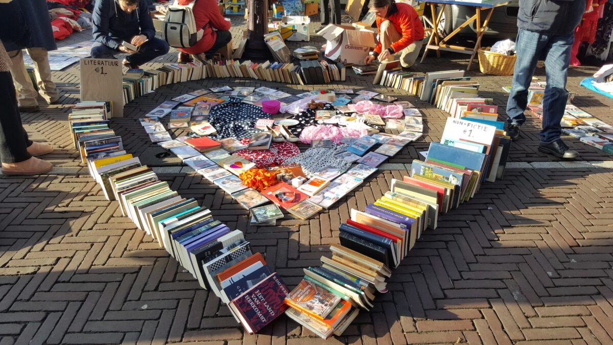 assorted books arrange in heart shape
