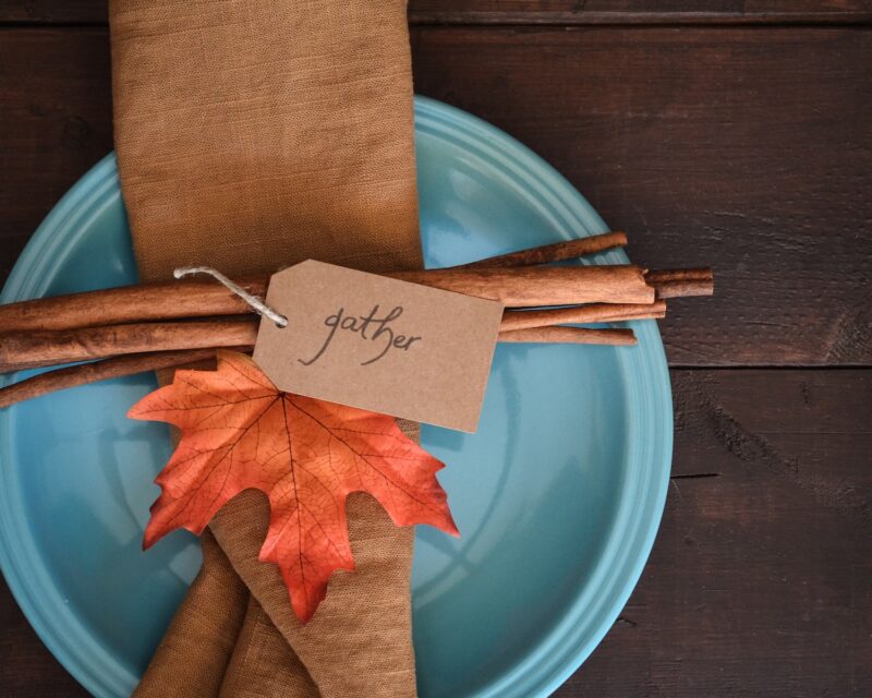 dinner plate with fall leaves and the word 