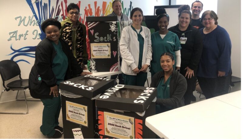 Nursing students and Recovery Center staff with Sock Drive collection boxes