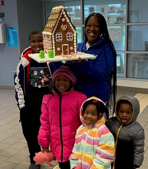 Kietisha Booker and family and their gingerbread house