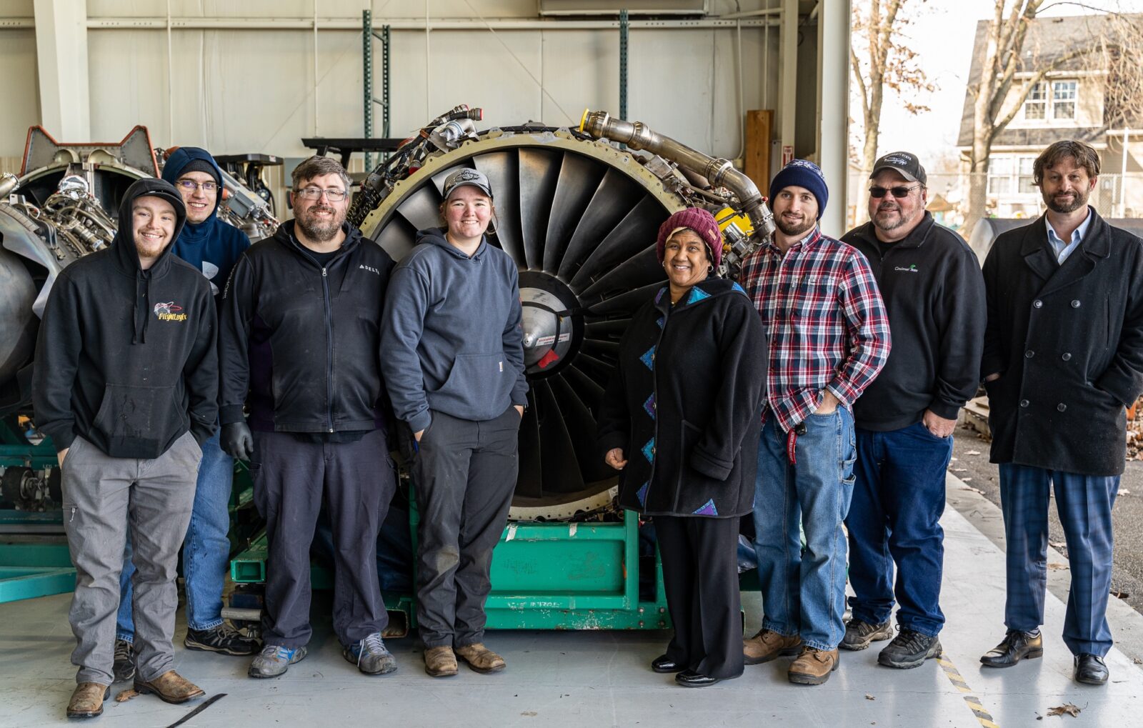 Aviation Maintenance Technology Students and (far right) Elliott Ruther, Chief of Advancement, (2nd from Right) Jeff Wright, AMT Program Chair, and (4th from right) Kim McMillan, Associate Dean, Engineering & Information Technologies Division