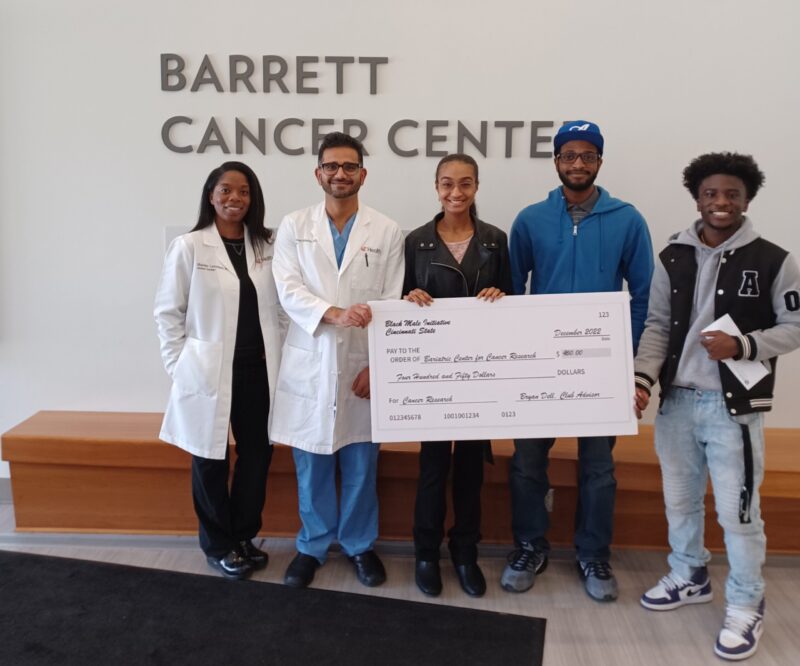 Nurse Shanice Lawrence and Dr. Abinhav Sidana received the cancer research donation from BMI members Naimah El-Amin, Dewud Njonjo-Carr, and Daniel Quao