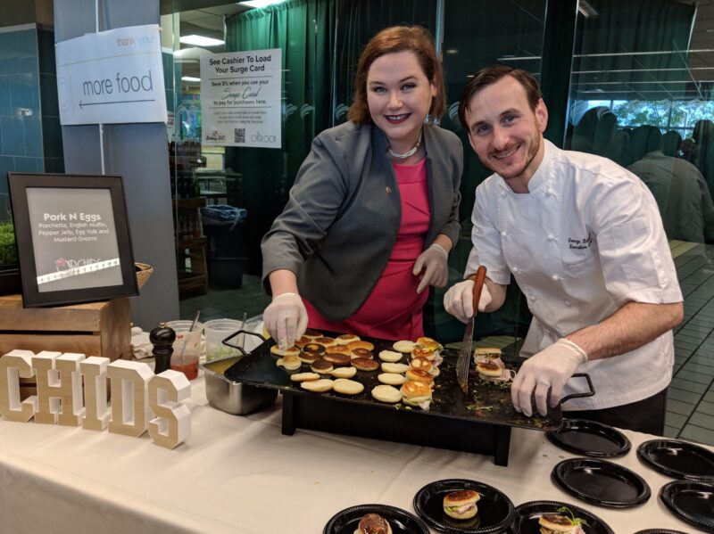 Chefs prepare food for guests at Eat-Play-Give fundraiser