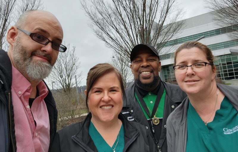Nursing students Nate Bulbain, Marsha Reed (Moore), and Kristen Reed with BMI advisor Bryan Dell
