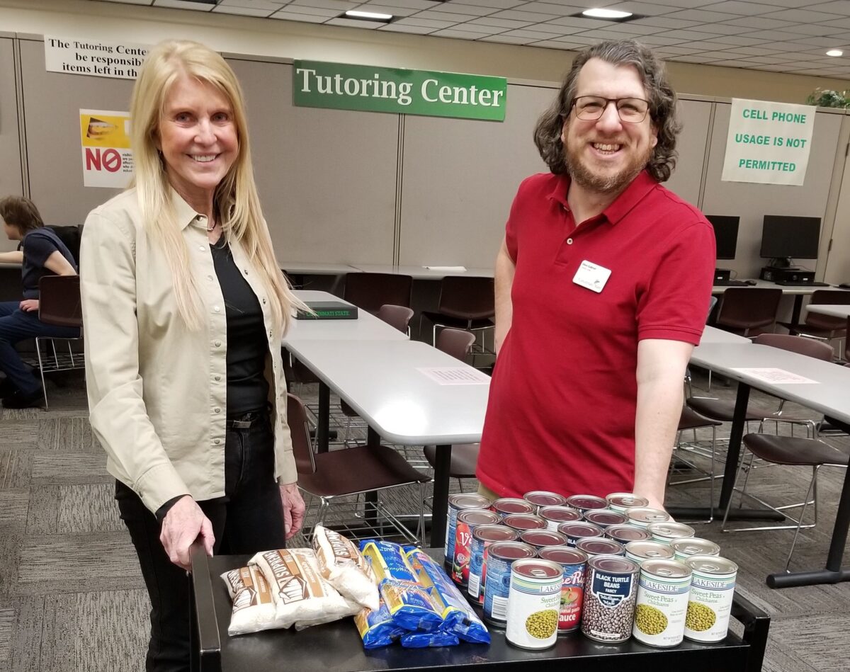 Lynn Hansen and Shea Gabriel with food donations from the Tutoring Center