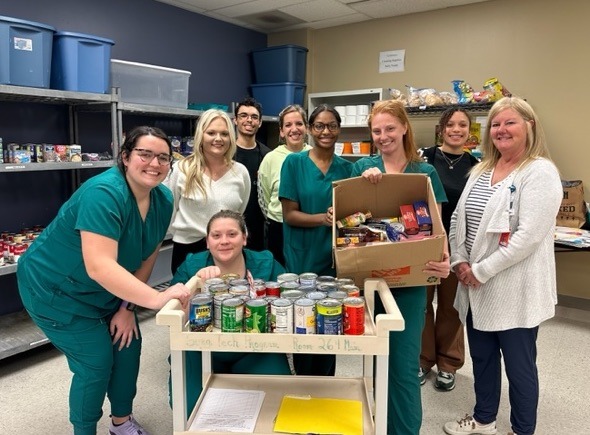 Surgical Technology Scrub Club members with Food Pantry donations