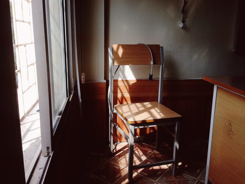 wooden chair with sun and shadows