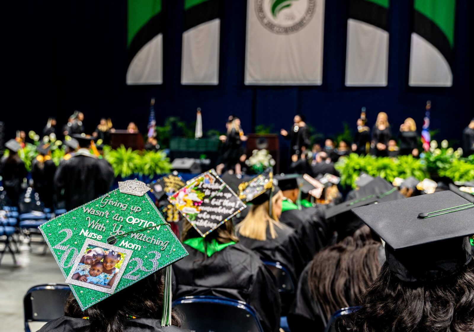 Graduates decorated their caps with messages of achievement