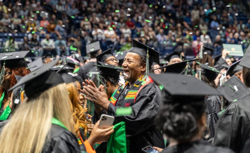 Students celebrating as confetti falls at the end of Cincinnati State Commencement 2023