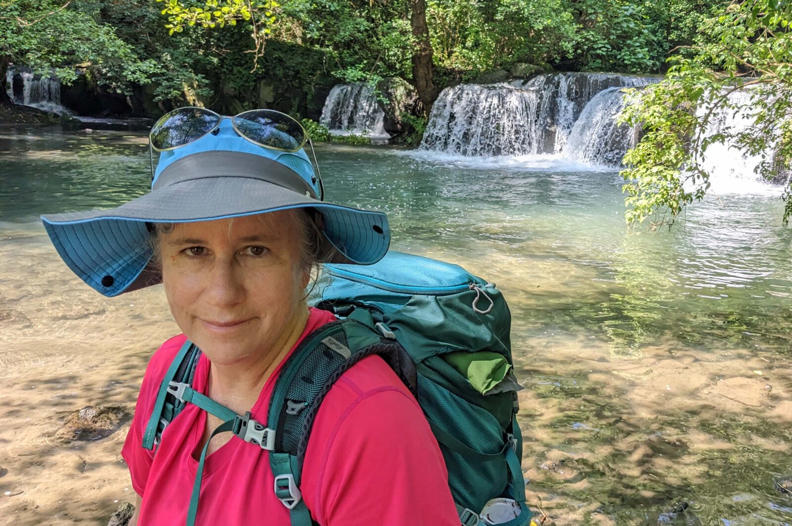 Karen stops to admire a waterfall