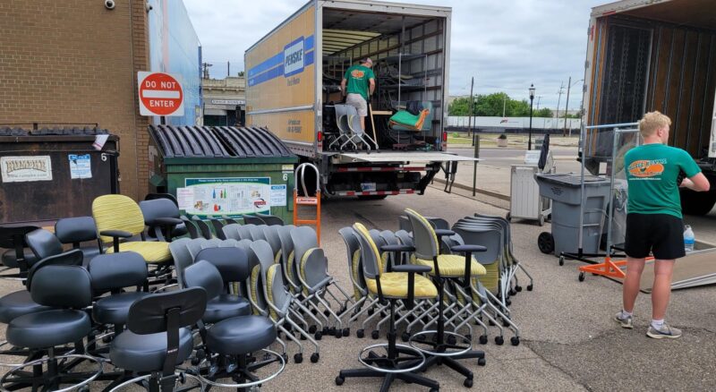 Moving crew loading furniture into a truck