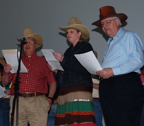 Rod Rupp, Lisa Lucas, and Gene Breyer singing at College event