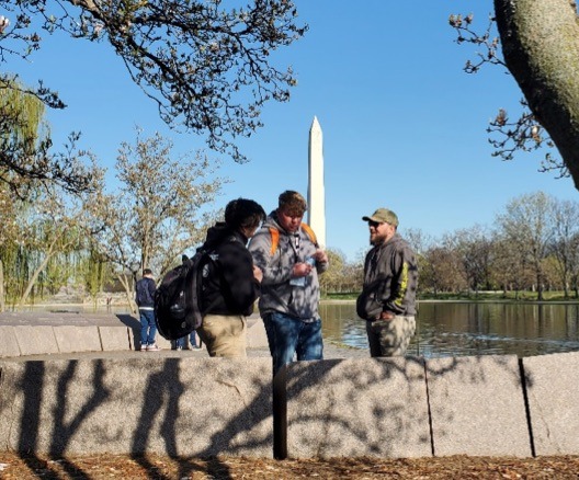 Team plans their next move on the National Mall