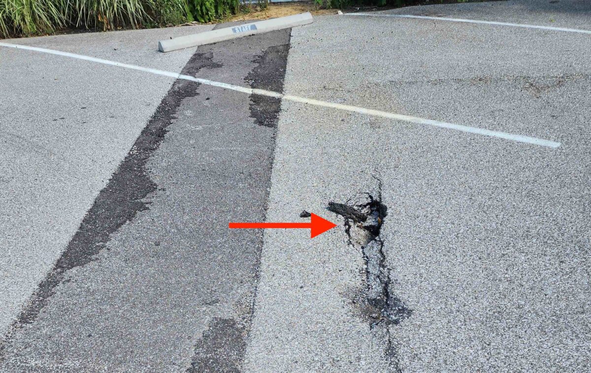 Photo of the large crack in the pavement in Parking Lot D