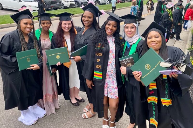 Seven graduates of the Practical Nursing Certificate program showing off their diplomas at Commencement 2023