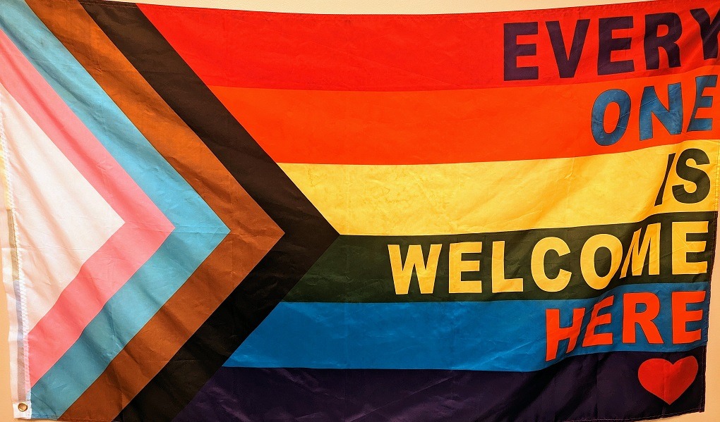 Pride flag with the words "Everyone is Welcome Here"