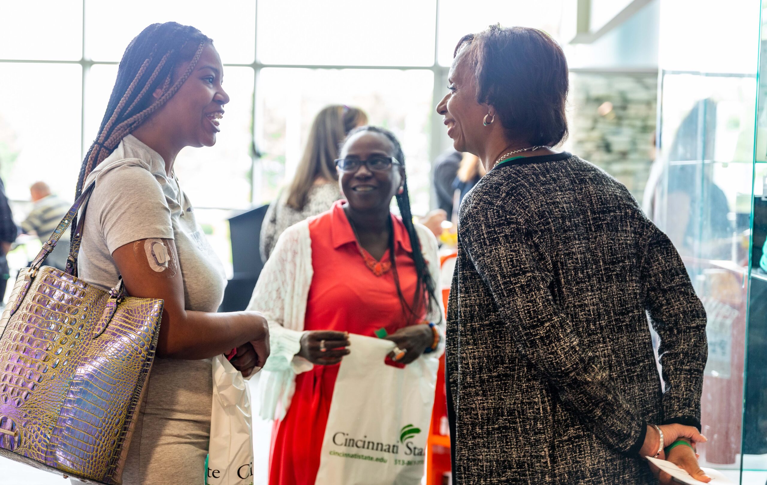 President Posey talks with Holiday Celebration attendees