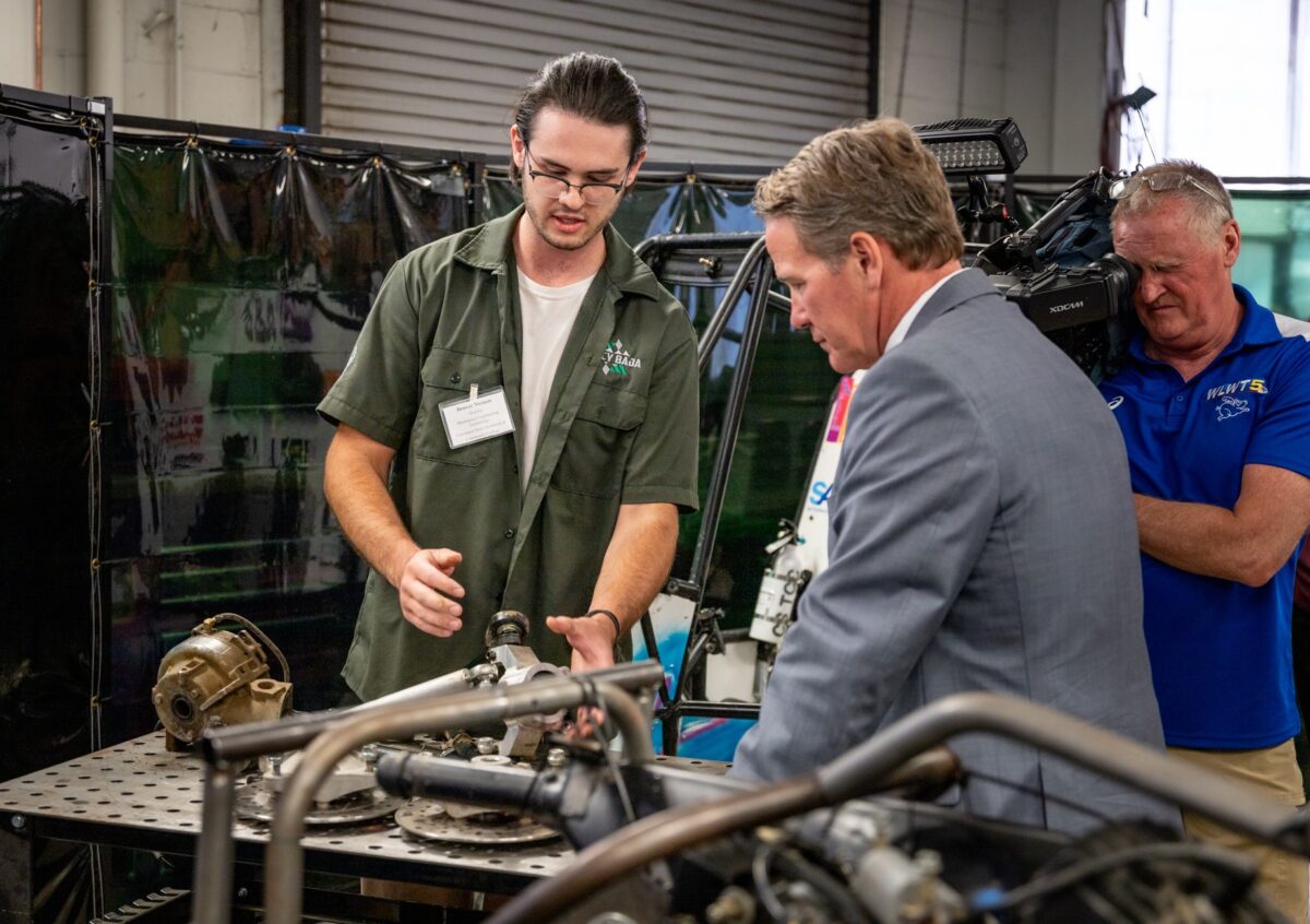 MET student Denver Nieman, demonstrated use of a 5-Axis Milling Machine to manufacturing complex parts more efficiently