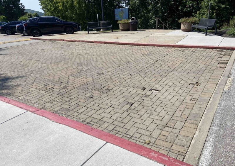 Photo of broken bricks in pavement