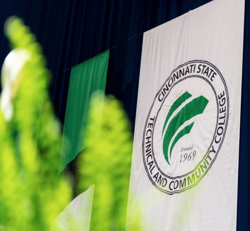 Cincinnati State seal seen on banner at Commencement