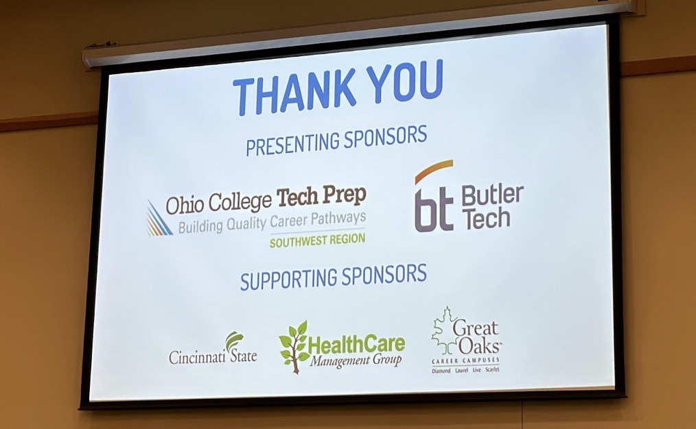 HealthFORCE sign showing Presenting Sponsors SW Ohio Tech Prep and Butler Tech, and Supporting Sponsors Cincinnati State, Health Care Management Group, and Great Oaks Career Campuses - 10-4-23
