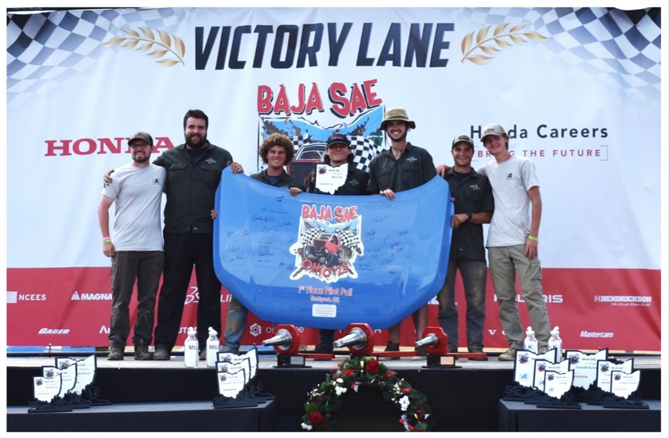 Cincy Baja team receiving Pilot Pull trophy
