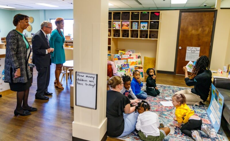 President Monica Posey and Ohio Gov. Mike DeWine observing storytelling for children in the Mallory Early Learning Center