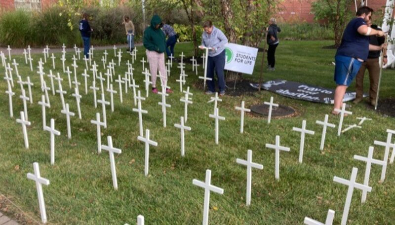 Cincinnati State Students for Life members installing their display of crosses in the ATLC Courtyard