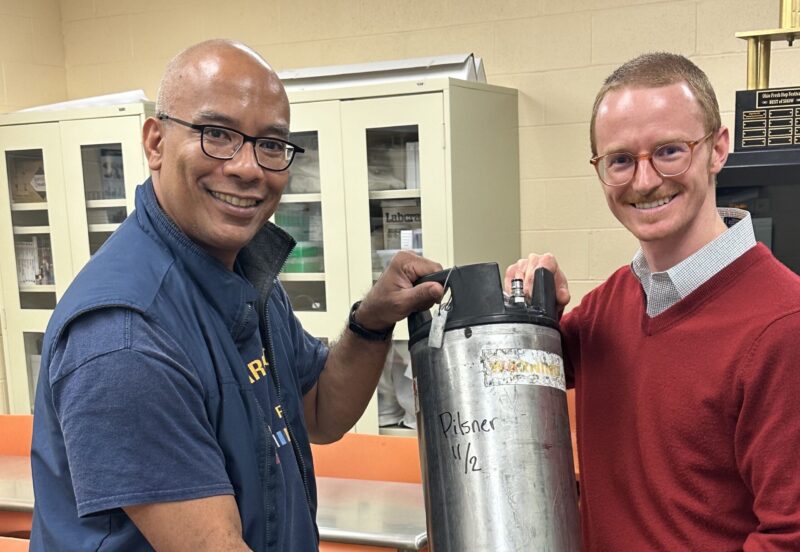 Stephen Collins, a former Marine who helped brew the beer that was tapped to celebrate Veterans Day, with Brewing Science Chair Caleb Ochs-Naderer