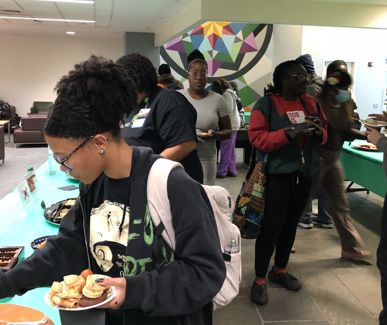 Students enjoying the treats at the International Coffee Hour