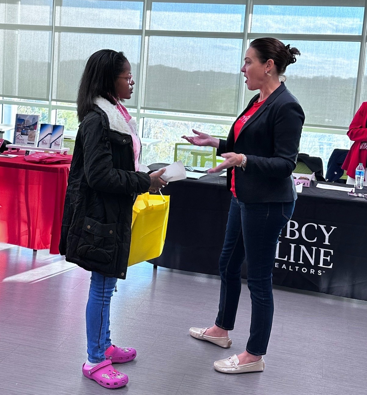 Student talks to a professional at the Real Estate event