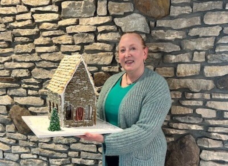 Dawn Wilke with gingerbread house