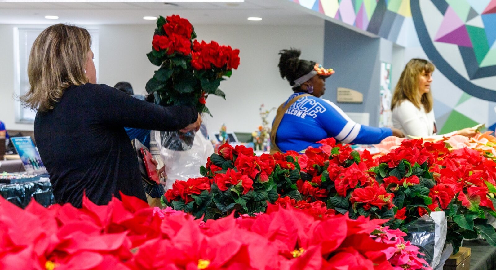 Choosing the best poinsettia at the WEN Market