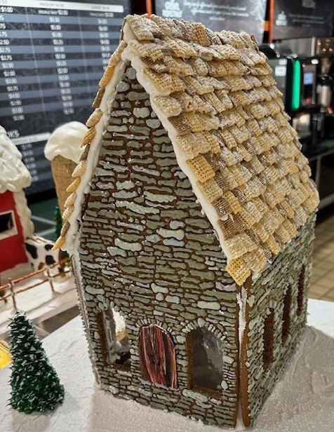 Gingerbread house with "thatched roof" constructed by Pastry Arts students