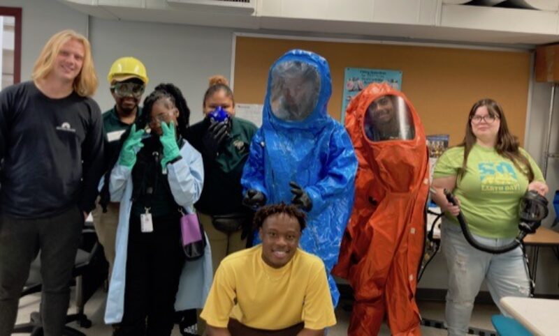 Group of students learning about protective gear during HS Environmental Day