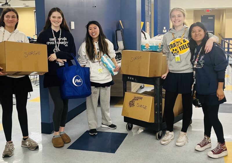 Students from St. Ursula Academy with their donations for the CState Food Pantry
