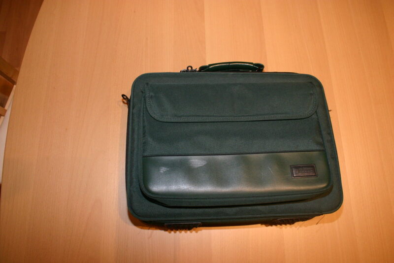 black laptop bag/case on a brown table