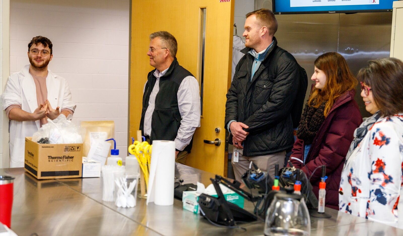 Culinary & Food Science student Justin Edsell talks with Tim Derickson (JobsOhio), Trevor Wellbrock and Sarah Daligga (REDI Cincinnati), and CFS Program Chair Grace Yek