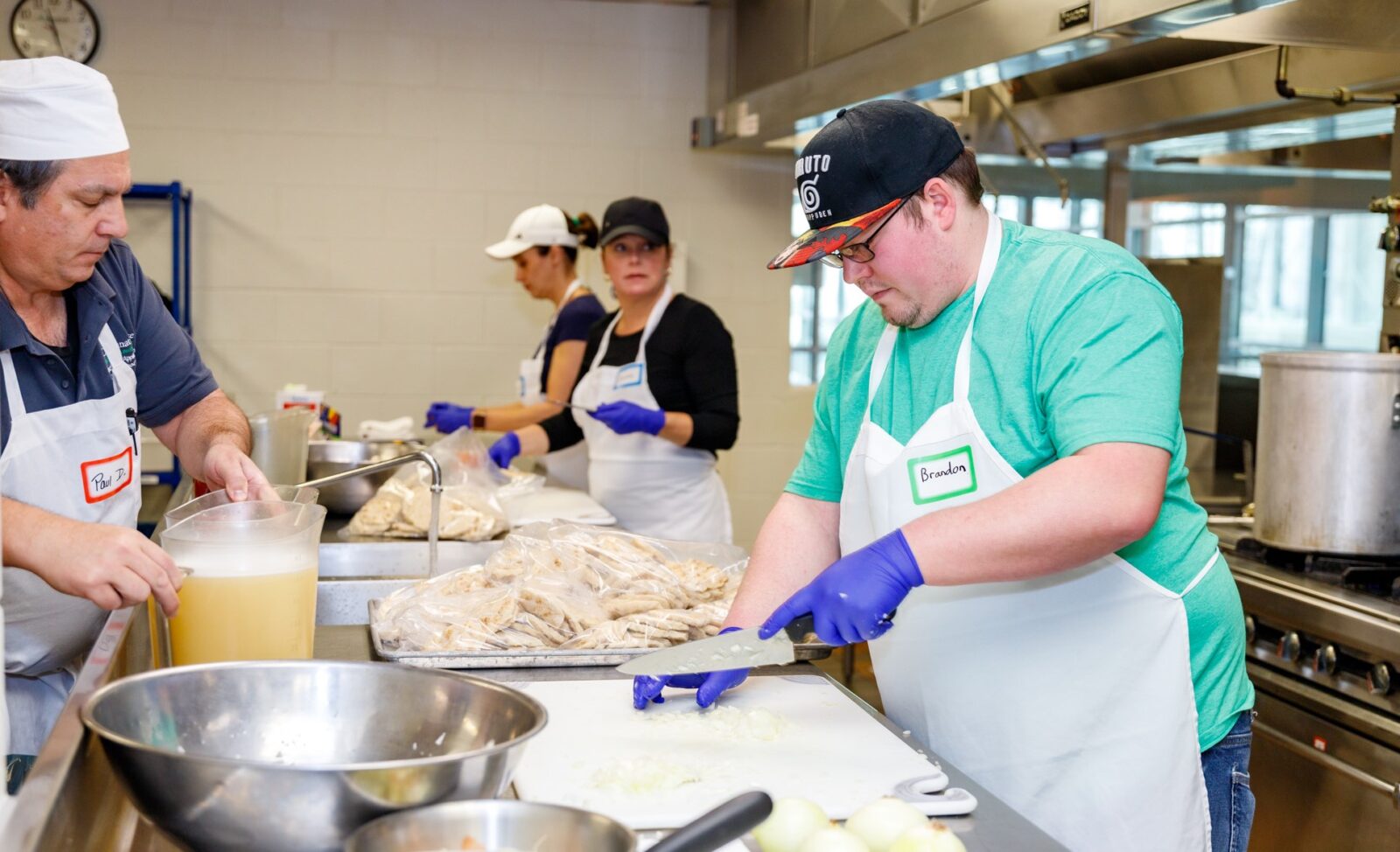 Students Paul D’Agostino & Brandon Brinkman (front) & faculty Wednesday Oster & Donna Von Deylen