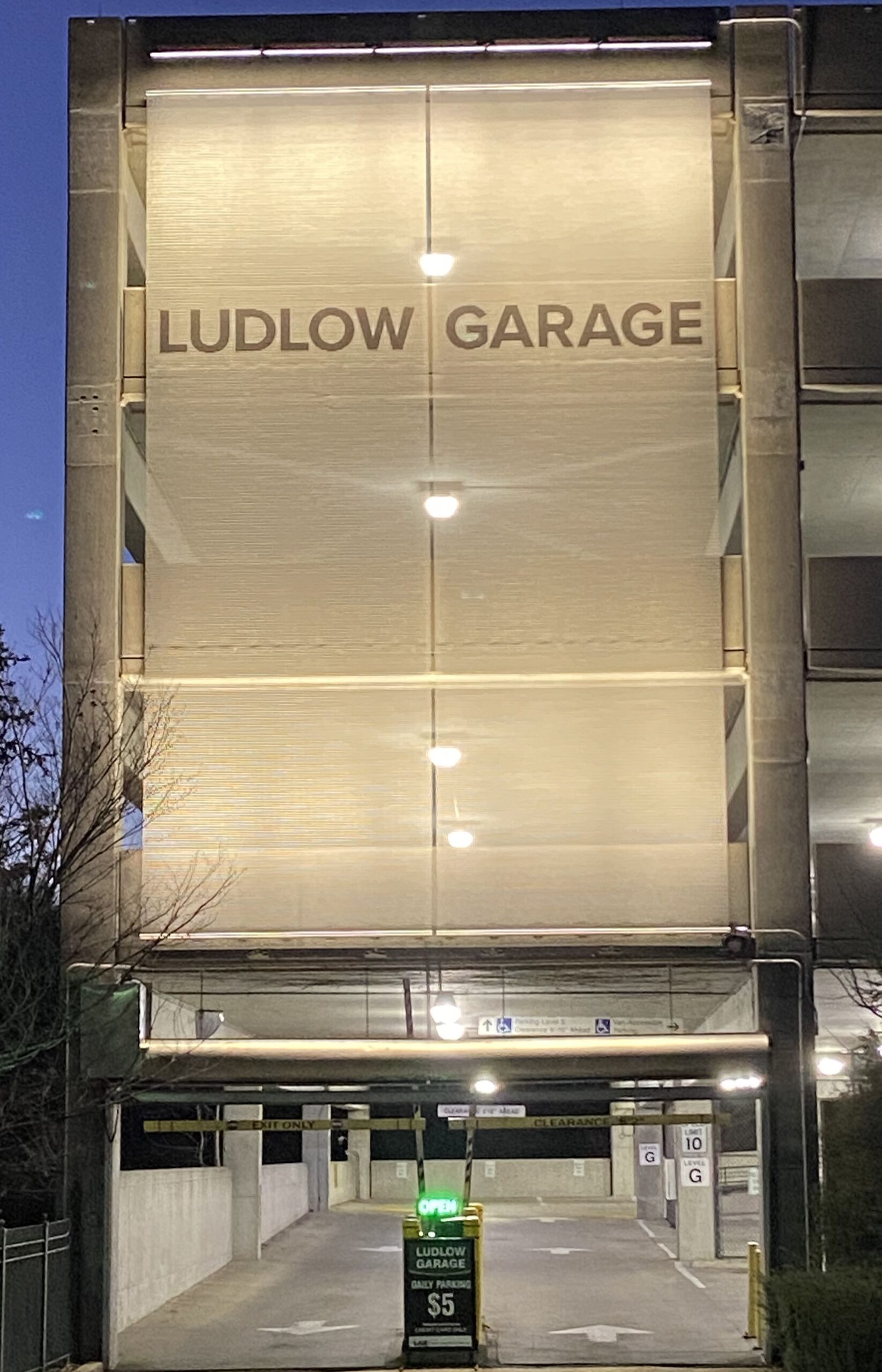 Ludlow garage sign, lit up at night