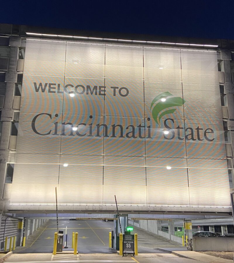 Mesh sign on Central Parkway garage with 