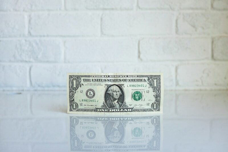 U.S. one dollar bill against a white background