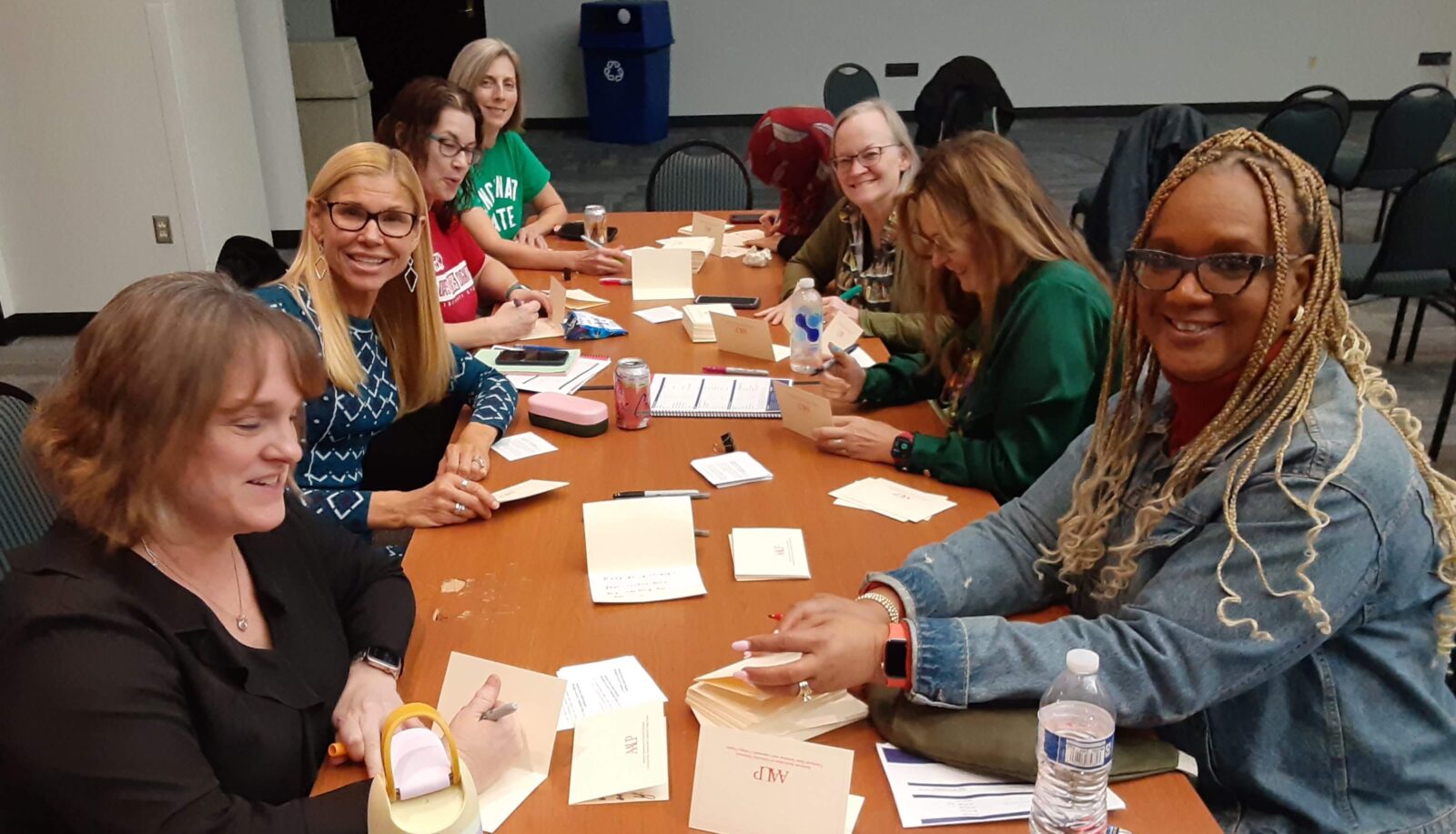 Faculty members writing notes of encouragement for the stress relief kits
