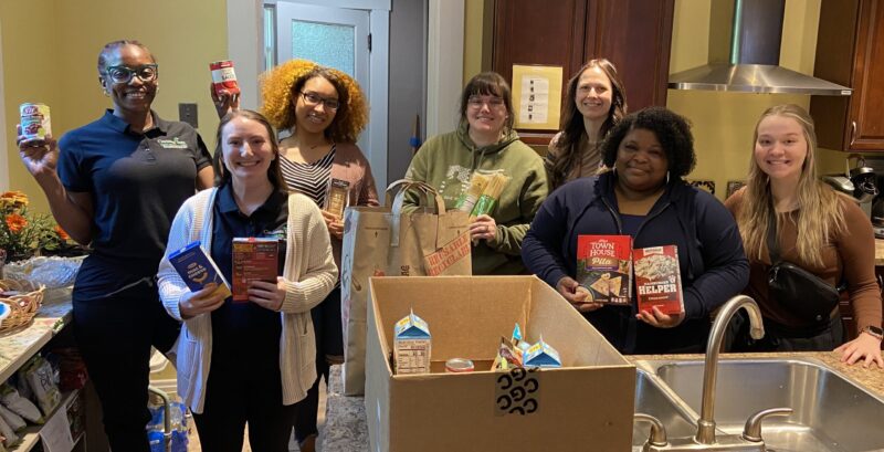 Student Occupational Therapy Association members with their donations for the Surge Cupboard