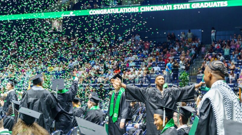 Graduates celebrating while the confetti falls at Commencement 2024