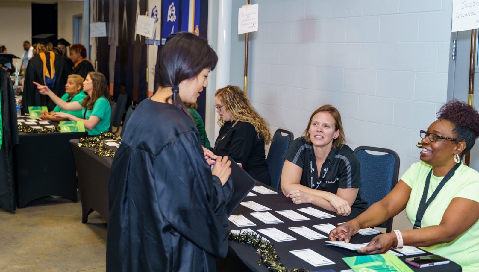 College staff members helped graduates check-in and prepare for the Commencement ceremony