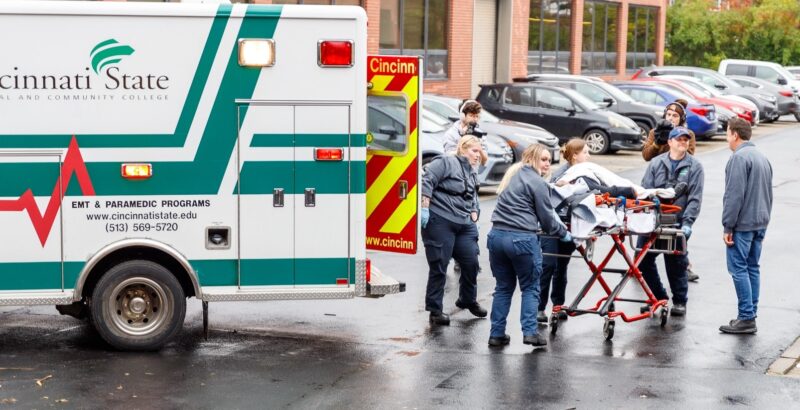 EMT and Paramedic students move a 