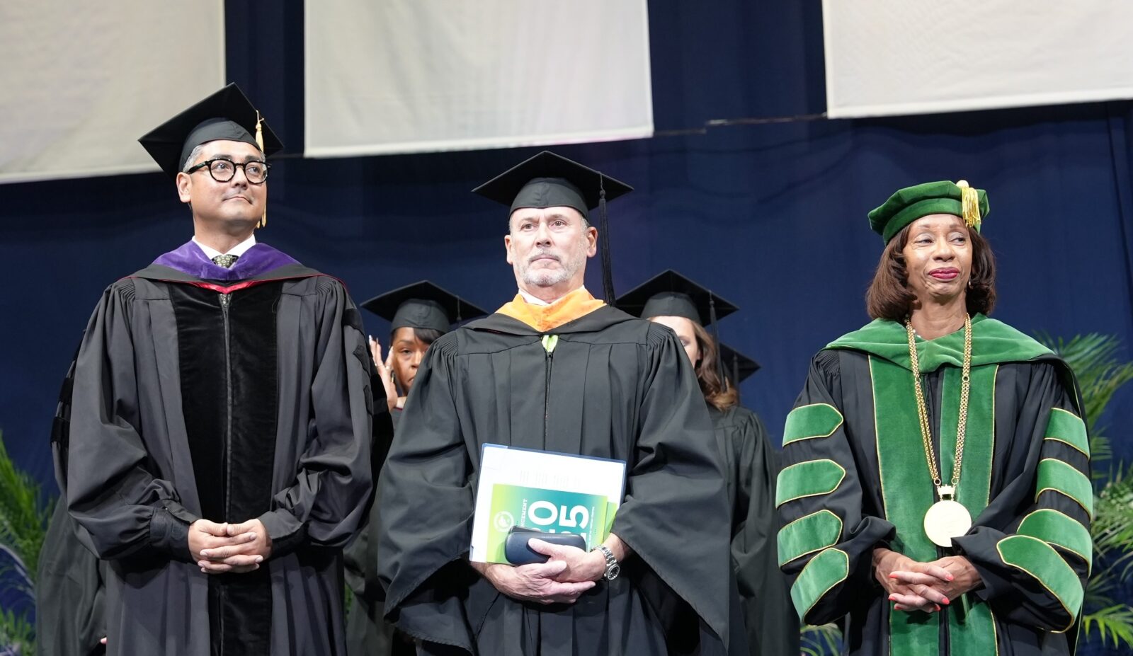 Mayor Aftab Pureval, Board of Trustees Chair John Silverman, President Monica Posey